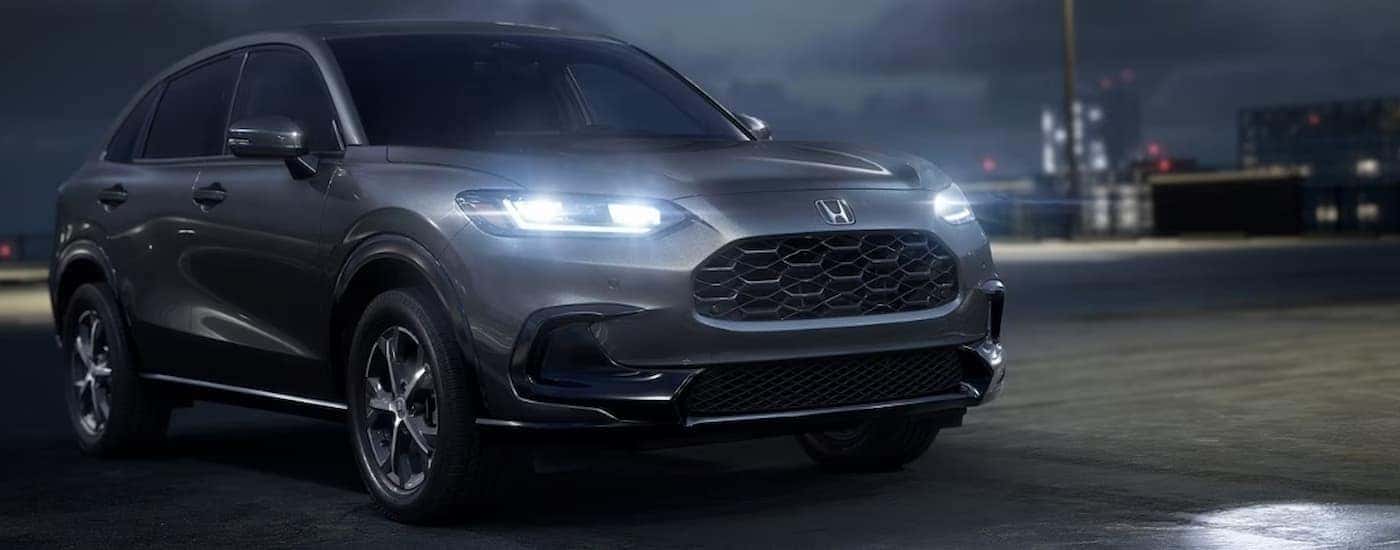 A gray 2026 Honda HR-V EX-L parked at night