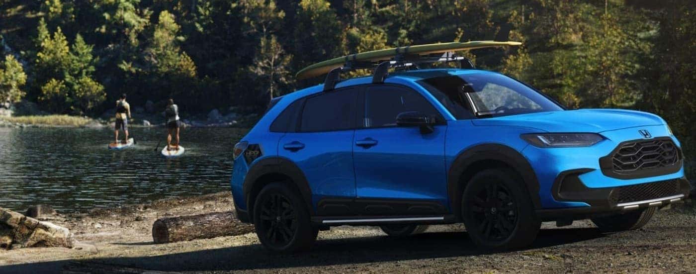 A blue 2026 Honda HR-V parked near water.
