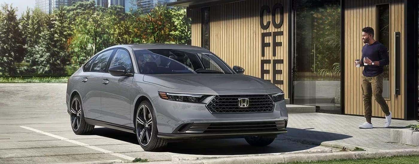 A gray 2026 Honda Accord parked outside a coffee shop