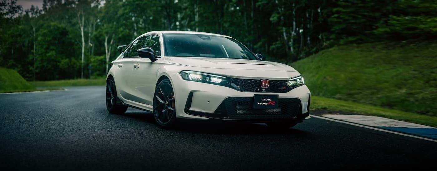 White 2023 Honda Civic Type R on a racetrack.