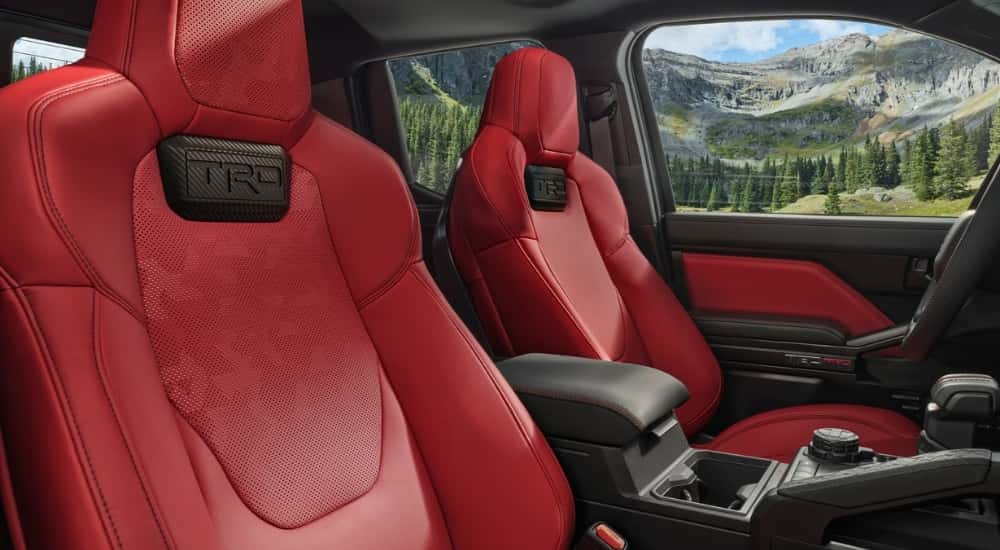 The red interior of a 2025 Toyota Tacoma.