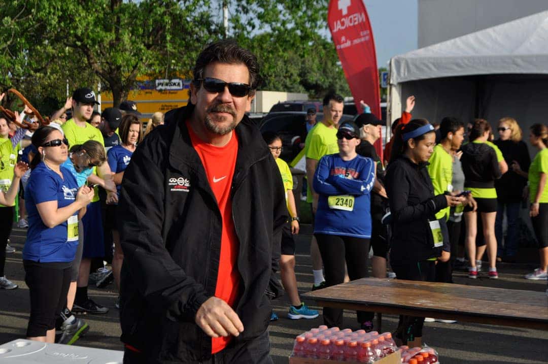 person at running race smiling