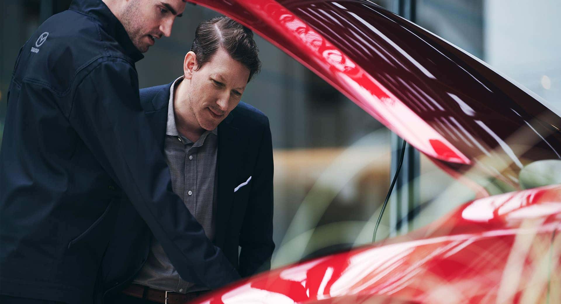 car owner bringing a vehicle in for service at a dealership