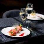 Plated food with wine served at an elegant restaurant