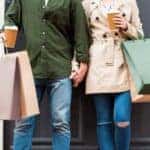 Man and woman holding shopping bags