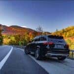 Mercedes-Benz SUV parked on a scenic highway