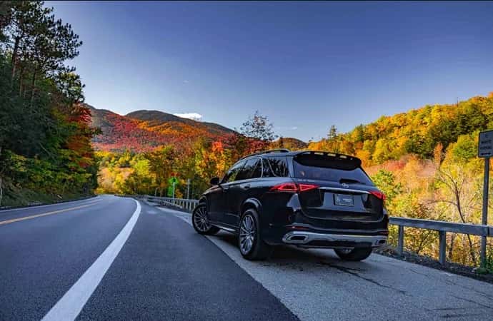 Mercedes-Benz SUV parked on a scenic highway