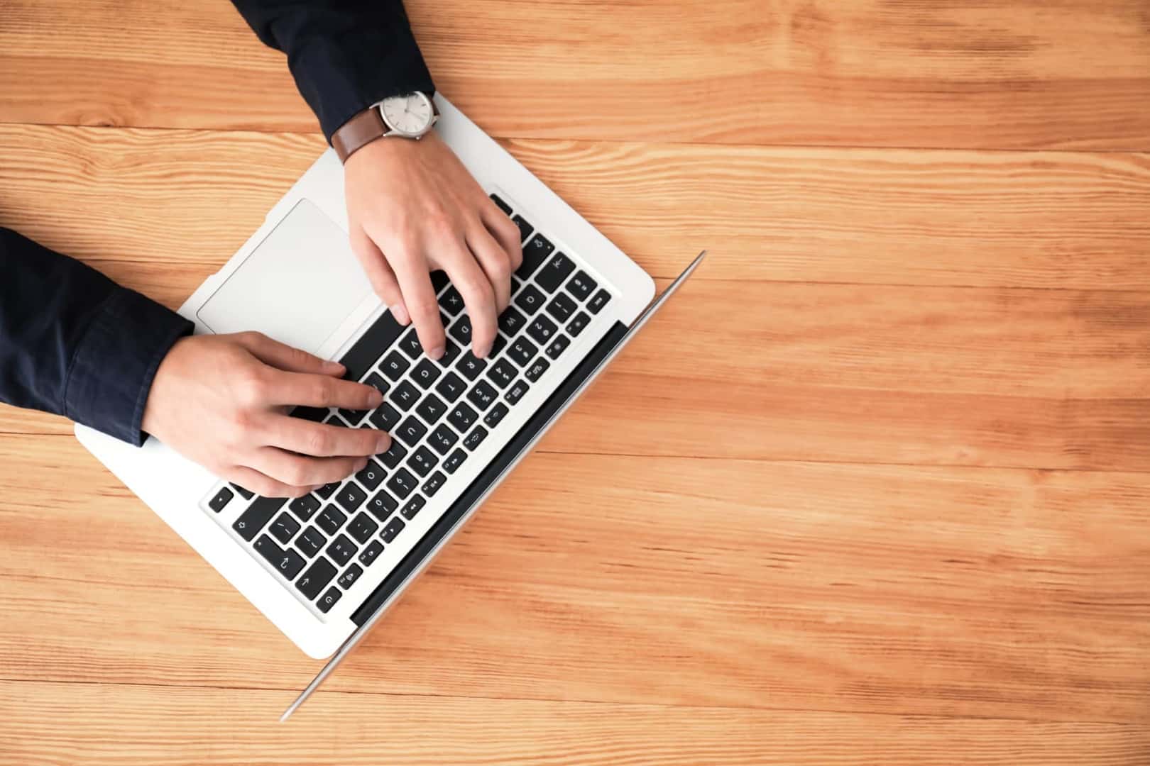 Overview shot of person doing research on laptop