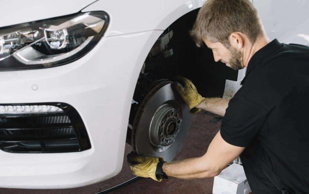 Technician working on brakes