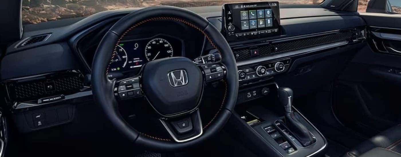 The black interior and dash are shown in a 2024 Honda CR-V.