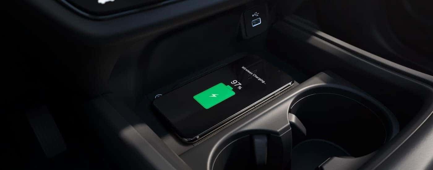 A cellphone is shown charging in the center console of a 2025 Honda HR-V for sale near Fort Worth.