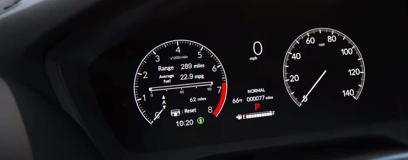 A close-up of the digital dash is shown in a 2025 Honda HR-V EX-L.