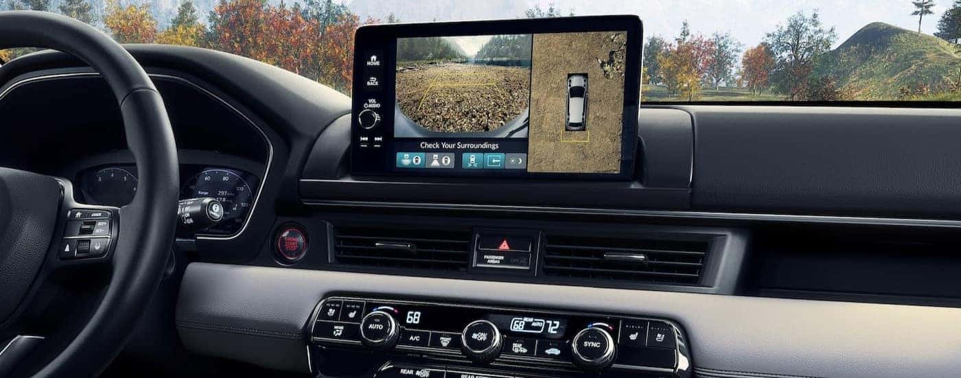 The black and gray interior and dash are shown in a 2025 Honda Pilot.