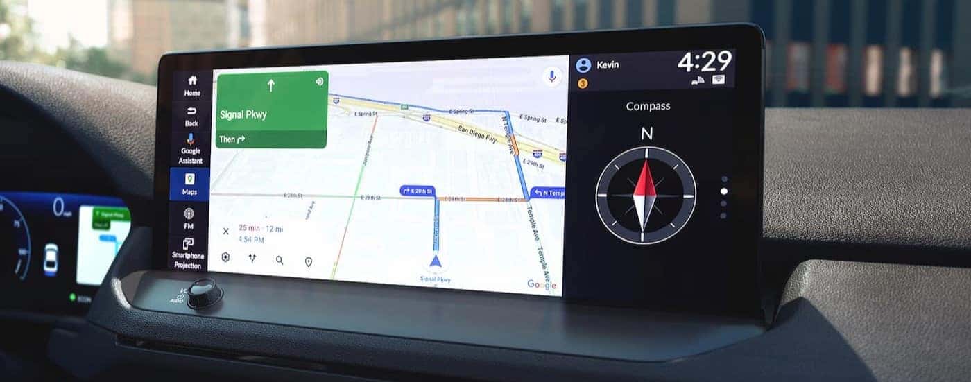 A close-up of the infotainment screen is shown in a 2025 Honda Accord Hybrid for sale near Irving.