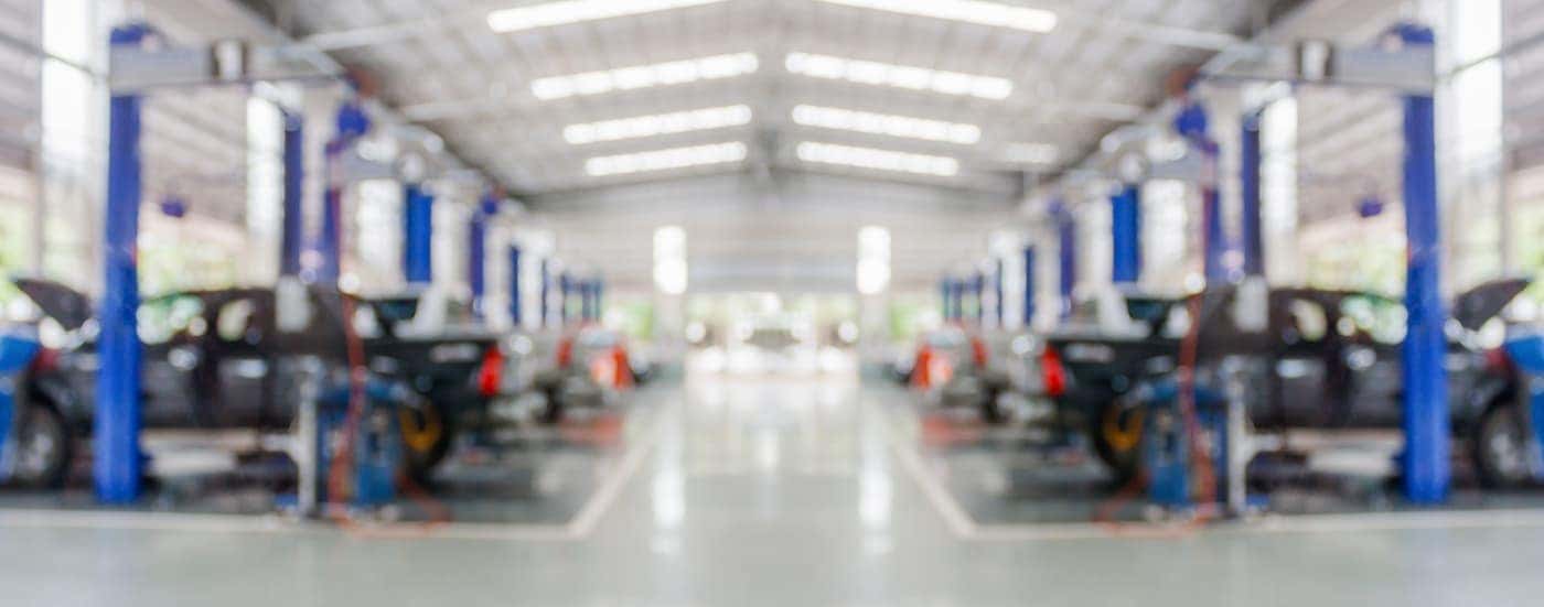 A garage bay is shown with many lifts.