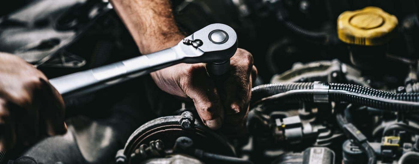 A mechanic performing a repair at a Honda service center near Southlake.