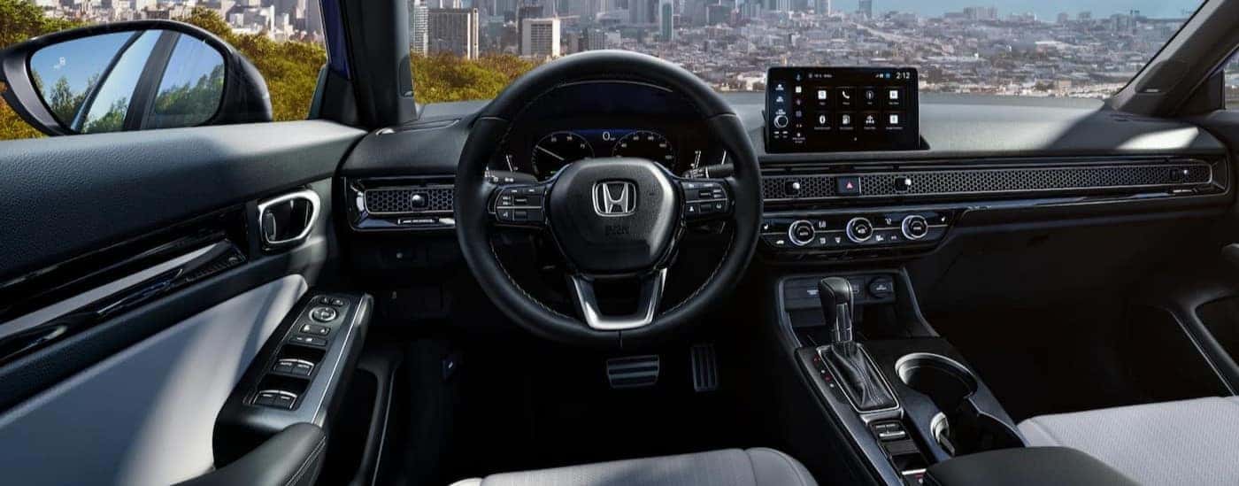 Black dash in a 2025 Honda Civic for sale.