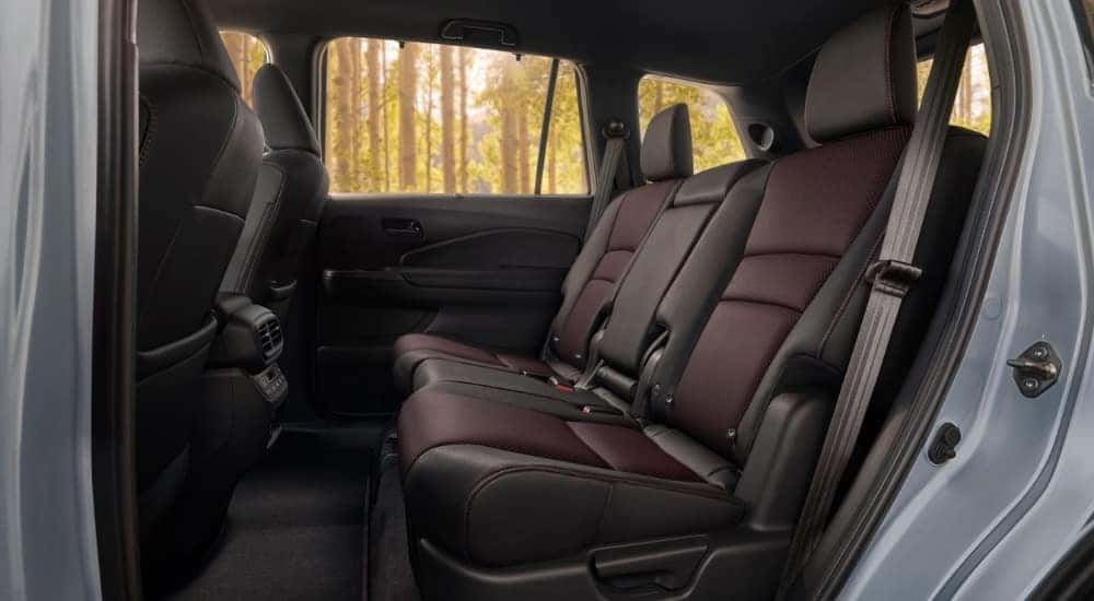The black and brown rear interior in a 2025 Honda Passport for sale.