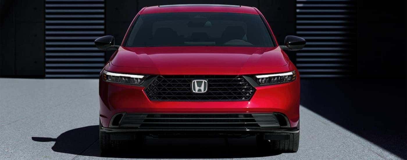 A red 2024 Honda Accord Hybrid for sale near Fort Worth is parked.