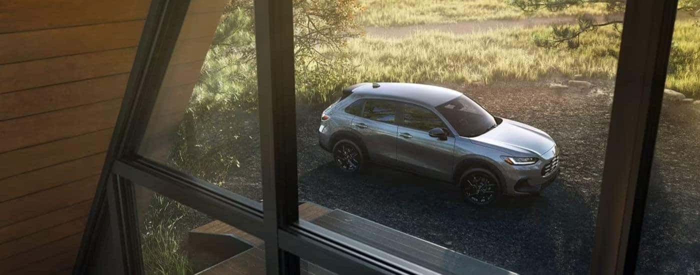 A silver 2025 Honda HR-V for sale parked outdoors.