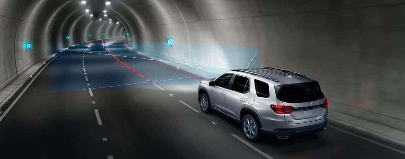 Simulated censors are being used by a silver 2025 Honda Pilot Sport.