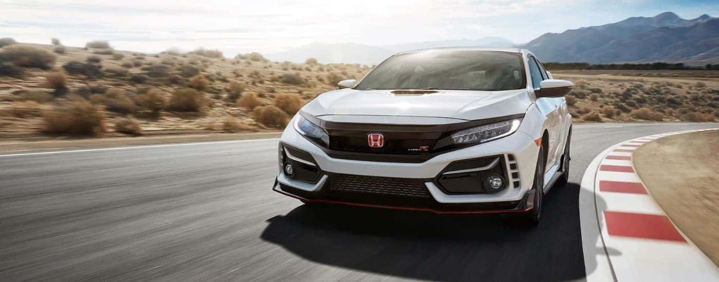 A white 2021 Honda Civic Type R is shown on a race track after leaving a Honda dealer near Irving.