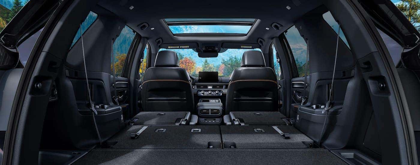 The black rear cargo area is shown in a 2025 Honda Pilot for sale near Keller.