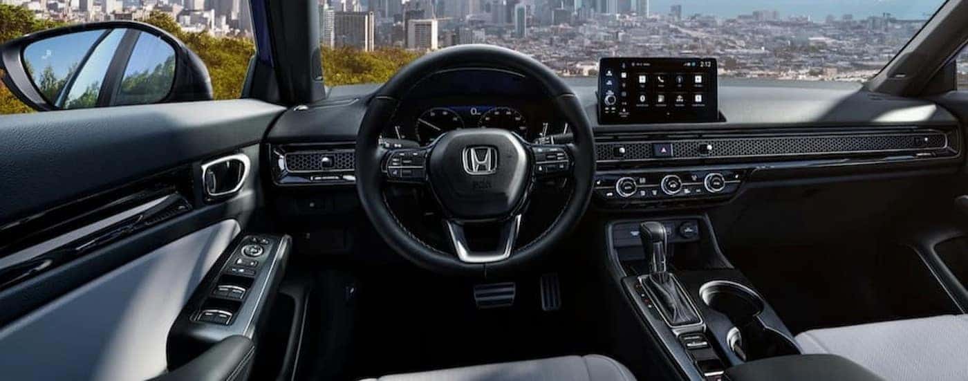 The black and white interior and dash in a 2025 Honda Civic for sale near Grapevine.