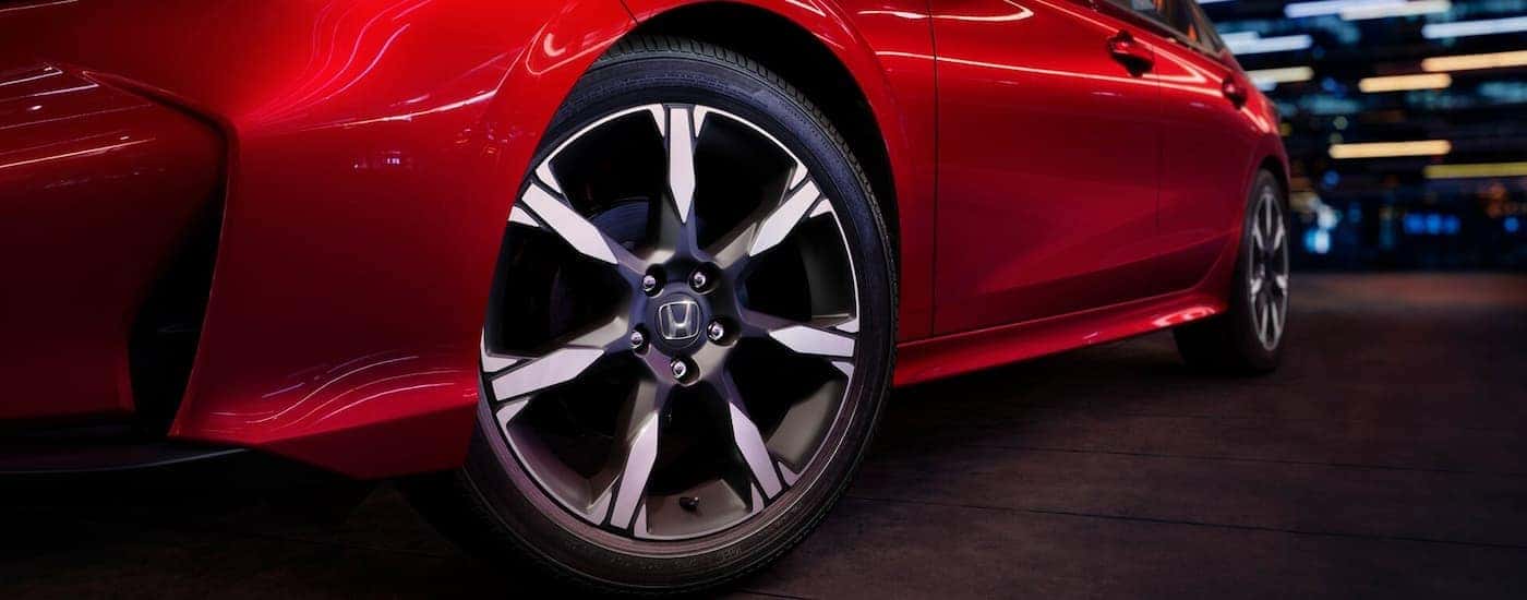 A rim and tire of a red 2025 Honda Civic for sale Near Arlington