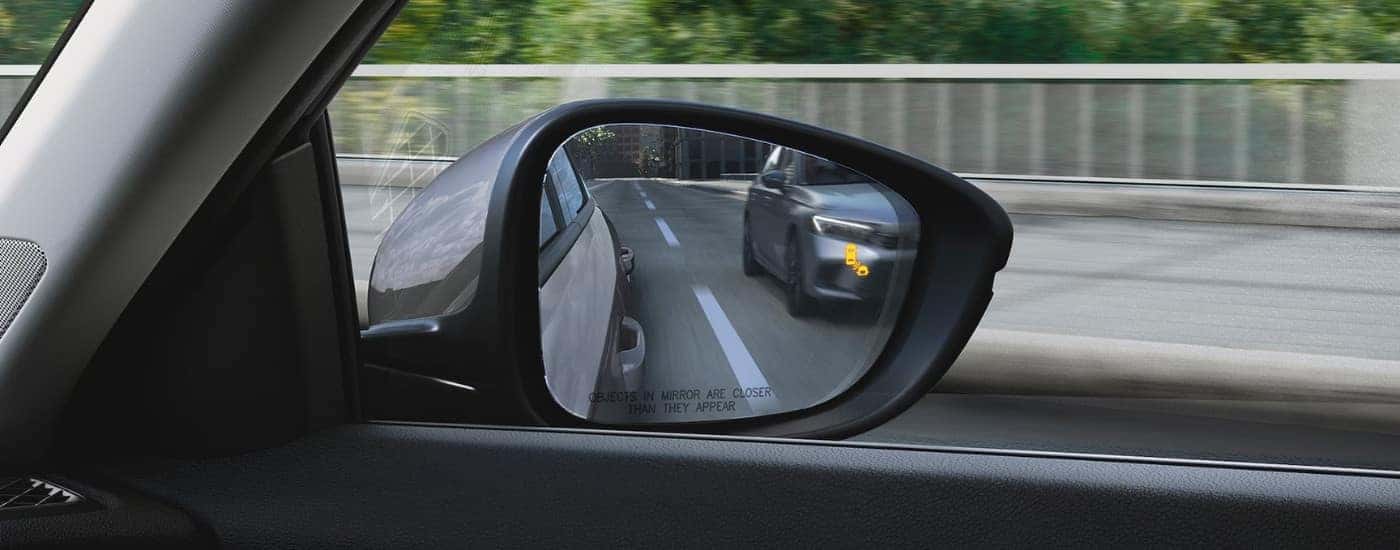Blind spot monitoring icon on the mirror of a 2025 Honda Accord