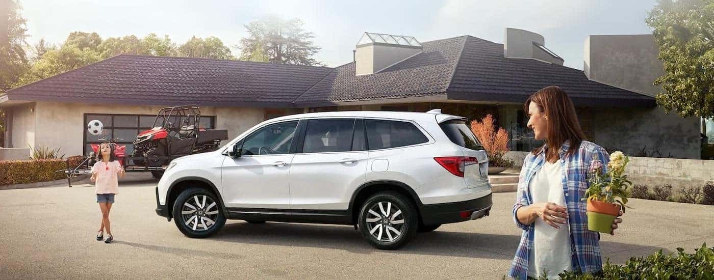 A parked white 2020 Honda Pilot for sale near Rhome.