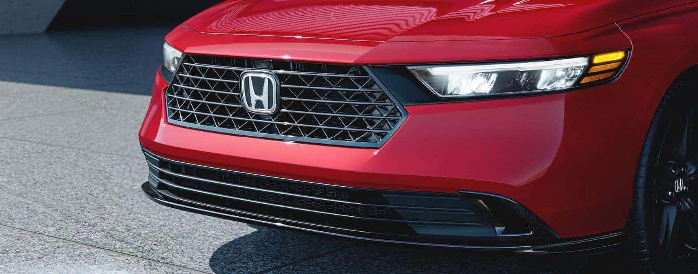Front grille of a red 2025 Honda Accord from a Honda dealer near Rhome