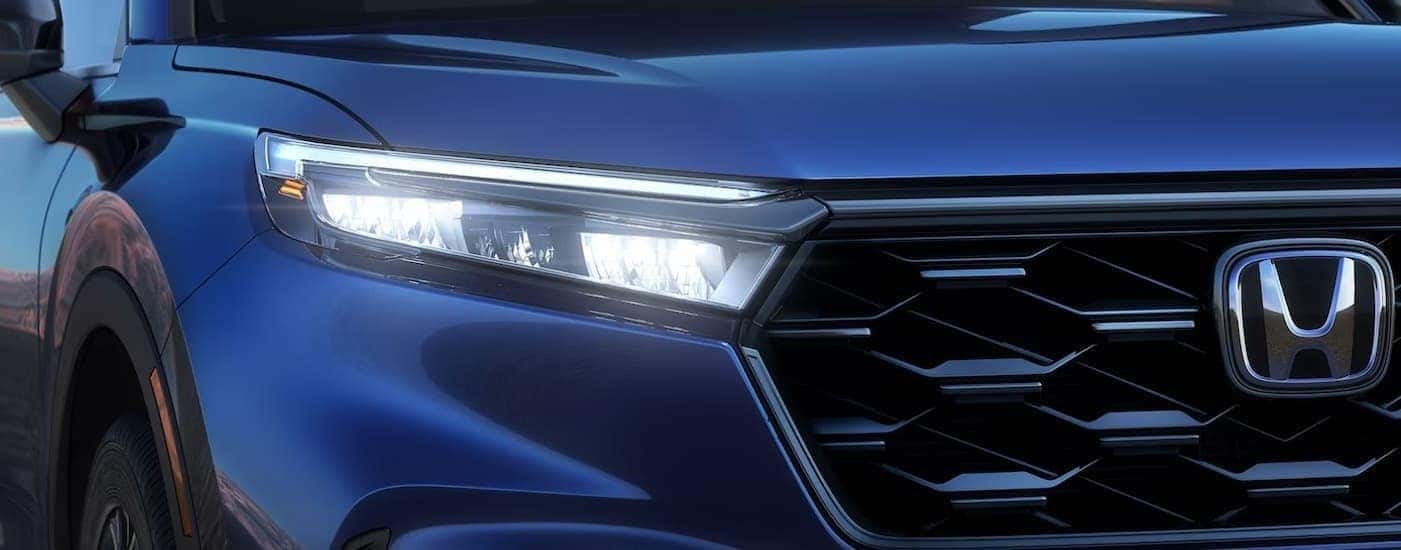 Close-up of the frontend of a blue 2024 Honda CR-V.