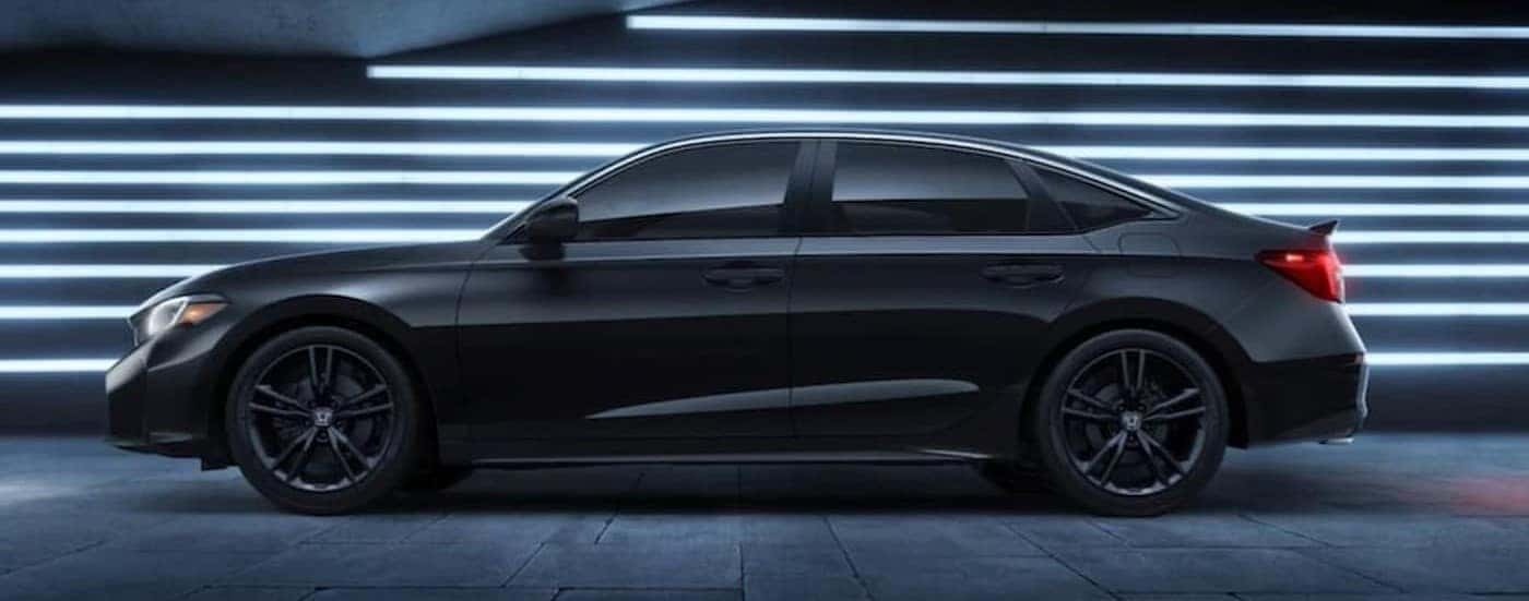 A black 2026Honda Civic Si parked in a showroom.