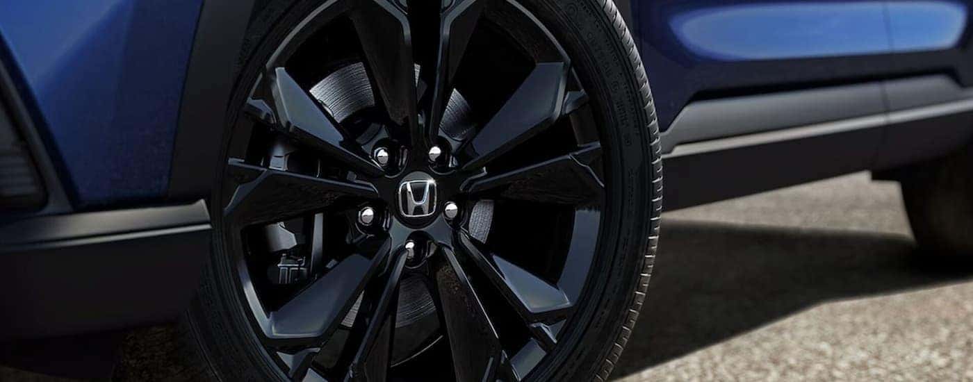 Side and tire on a blue 2026 Honda CR-V