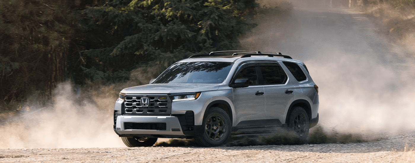 Grey 2026 Honda Pilot kicking up dust