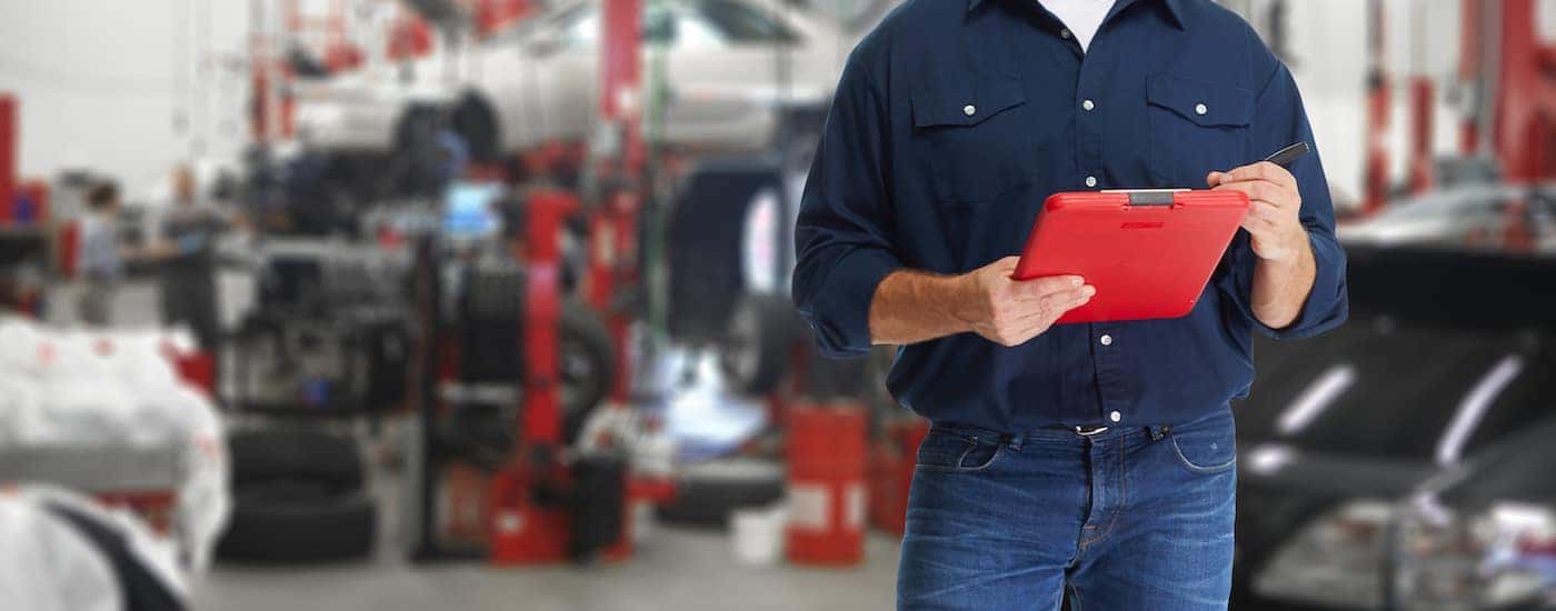 A technician holding a clipboard.