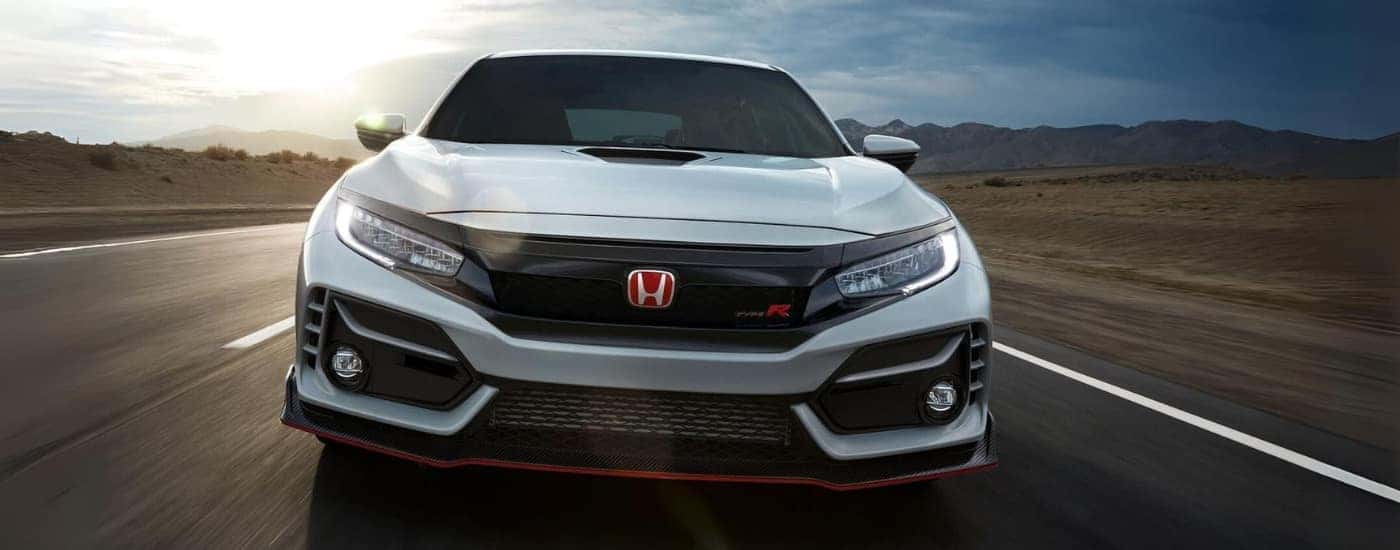A white 2021 Honda Civic Type R shown driving head-on.