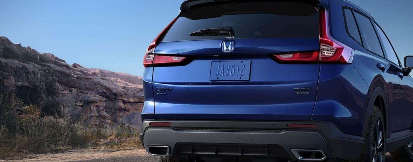 Rear view of a Blue 2026 Honda CR-V Hybrid TrailSport.