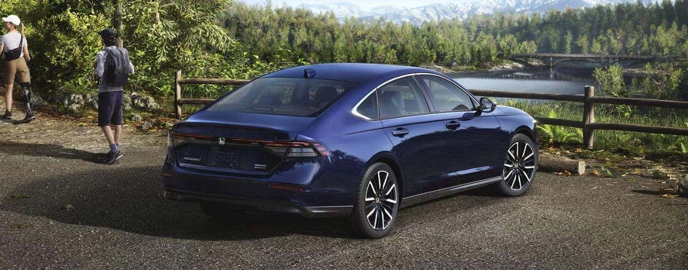 2026 Honda Accord rear view parked in front of a river.