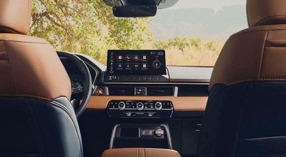 Infotainment display in a 2026 Honda Passport TrailSport from back seat view.