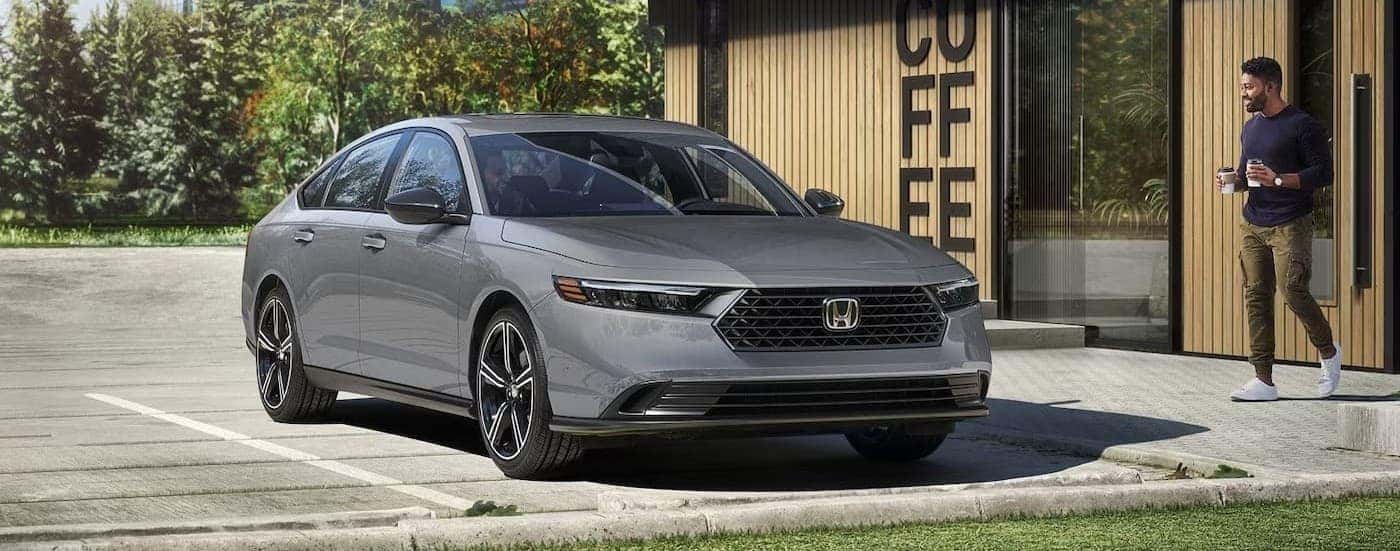 A gray 2026 Honda Accord parked near a coffee shop.