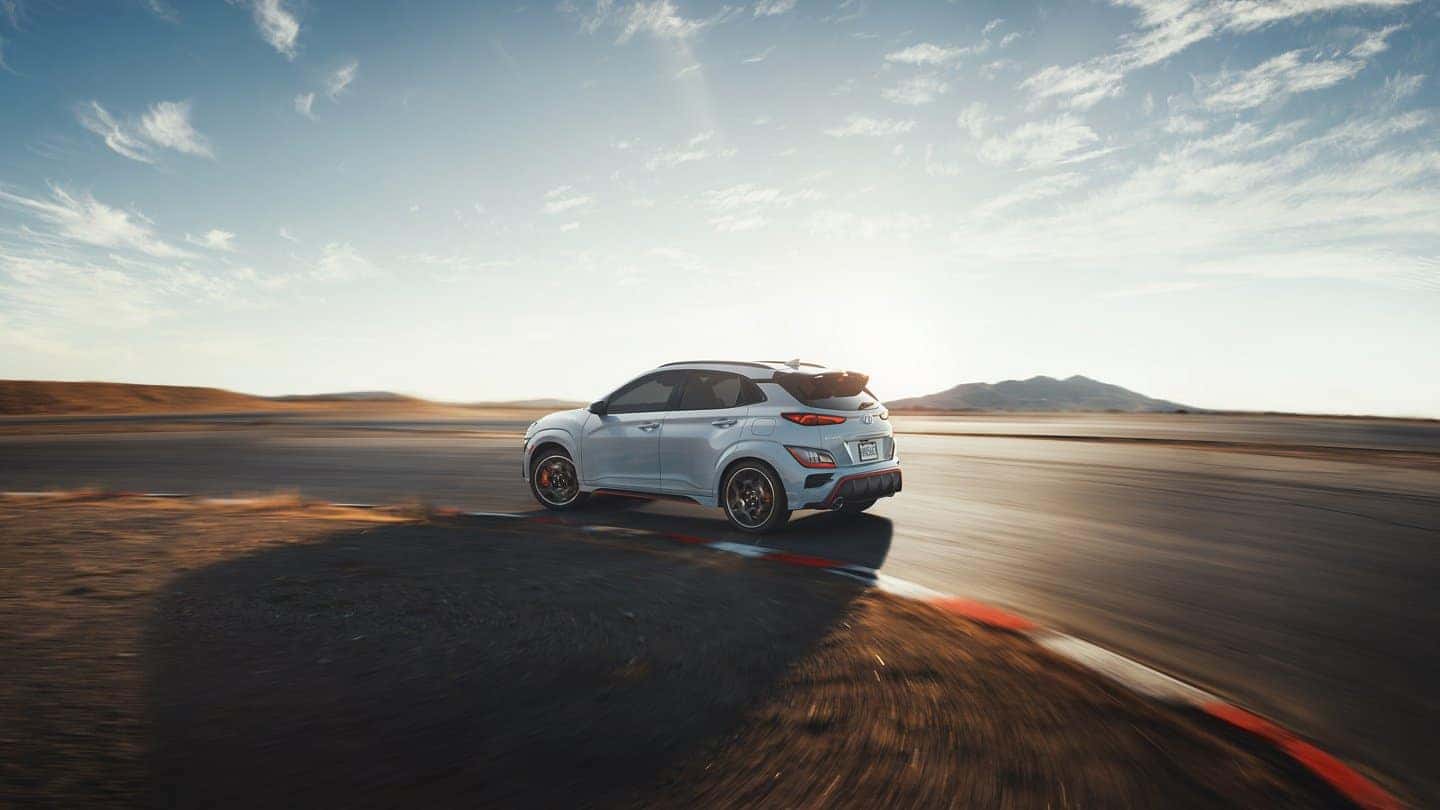 outer view of 2022 hyundai kona N sonic blue on the racetrack