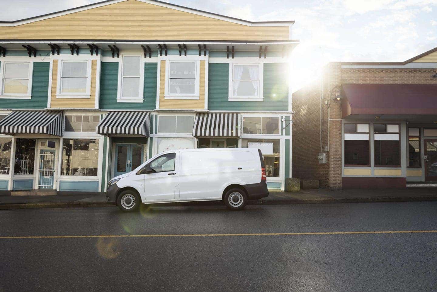 sprinter van parked in front of neighborhood building
