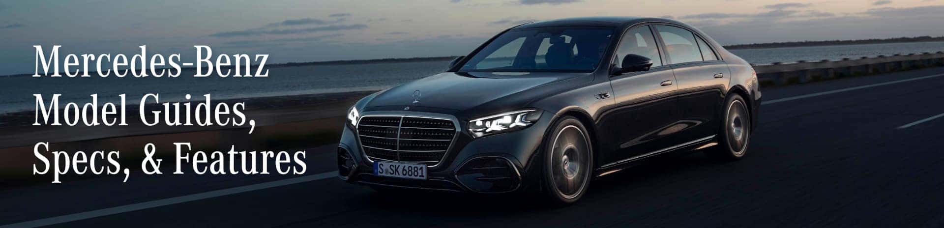 Image of a black Mercedes driving down the road