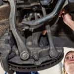 mechanic repairing brakes