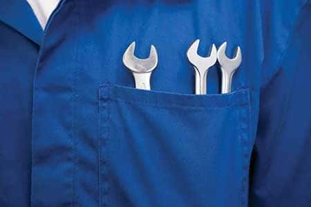 A service worker with tools in his pocket.