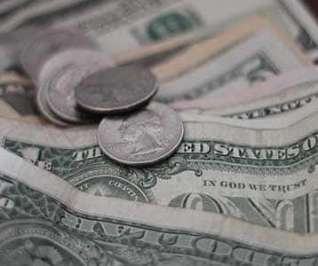 Some dollar bills and change.