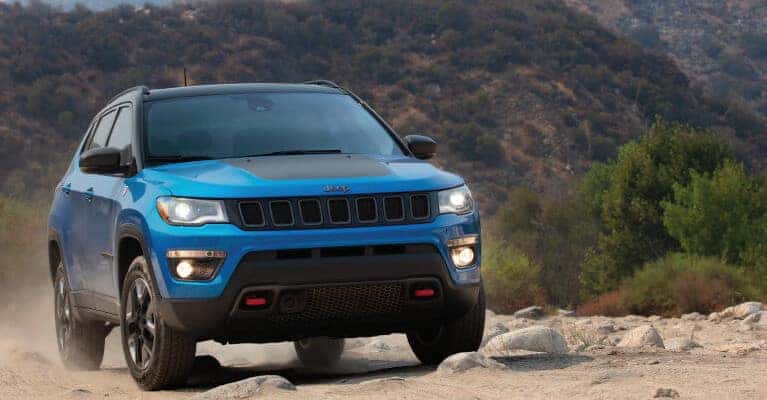 Blue 2019 Jeep Compass near mountains