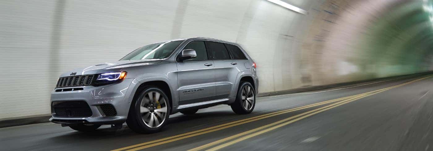 Silver Jeep Grand Cherokee in tunnel